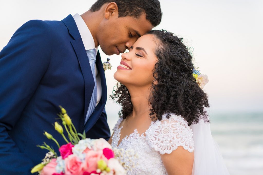happy attractive black couple smiling at their wedding